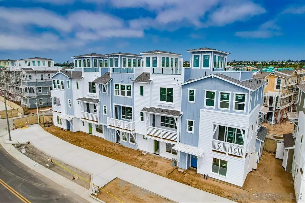 7064 Ponto Road Carlsbad, CA 92011 - Photo 6 of 28 a view of a building with a lot of windows