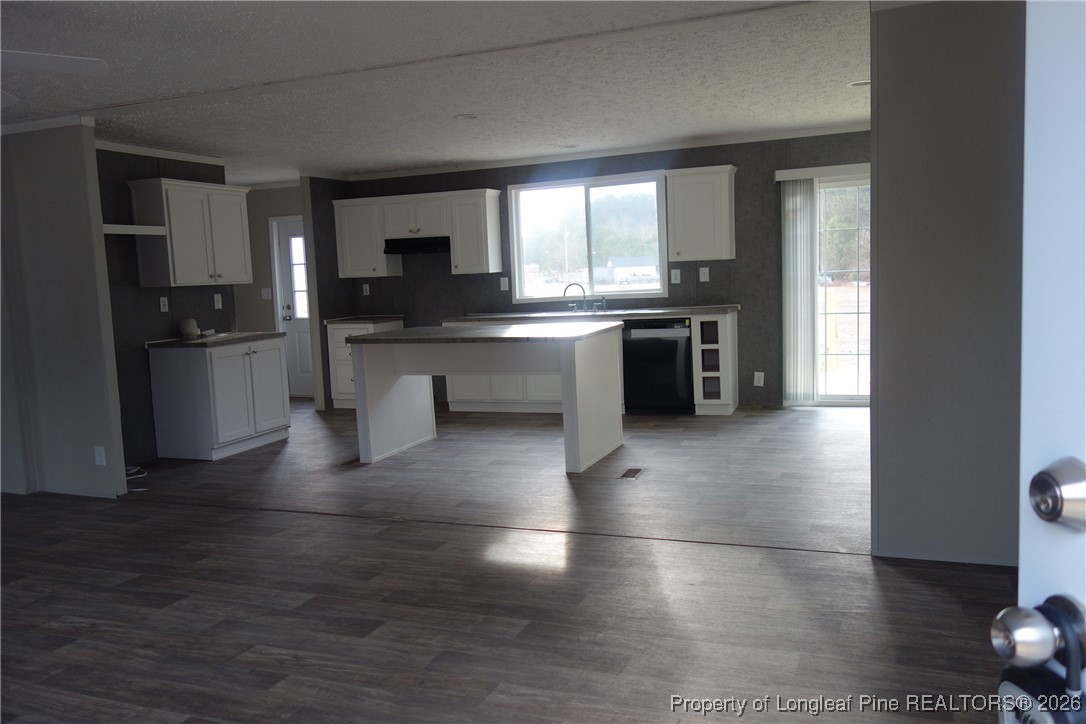 1438 Twisted Hickory Road Elizabethtown, NC 28337 - Photo 2 of 15 a kitchen with stainless steel appliances granite countertop a stove a sink and a refrigerator