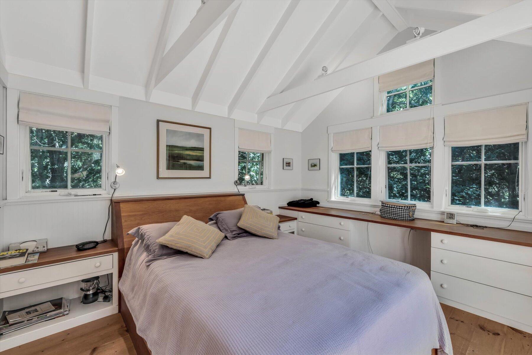 16 Tom's Hill Road Truro, MA 02666 - Photo 12 of 27 a bedroom with a large bed and a large window