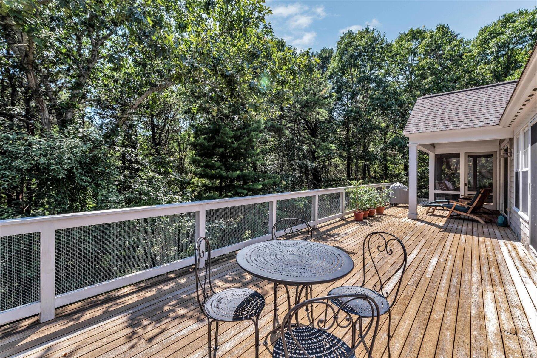 16 Tom's Hill Road Truro, MA 02666 - Photo 21 of 27 a view of a table and chairs in patio