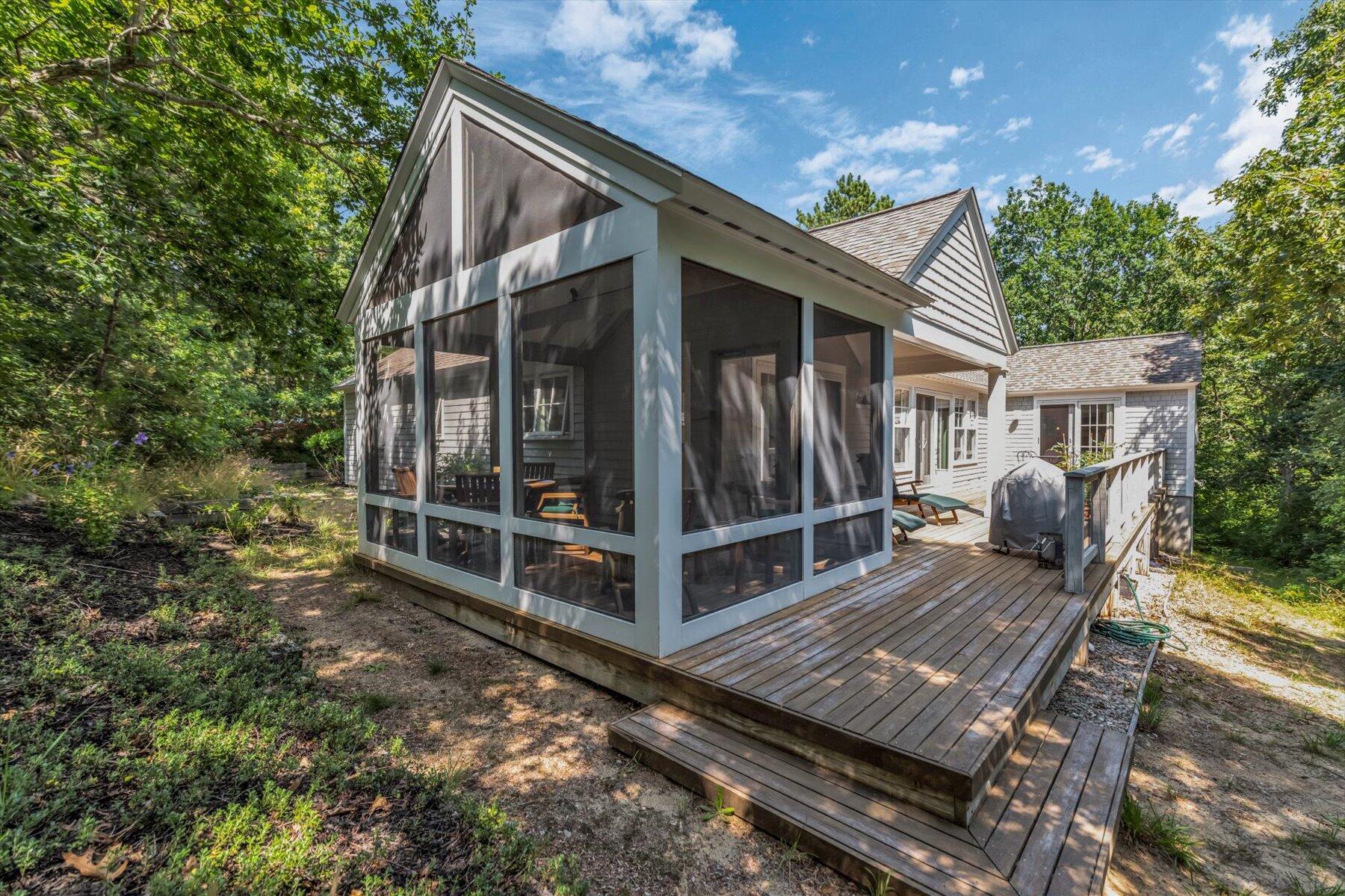 16 Tom's Hill Road Truro, MA 02666 - Photo 22 of 27 a view of a house with backyard and sitting area