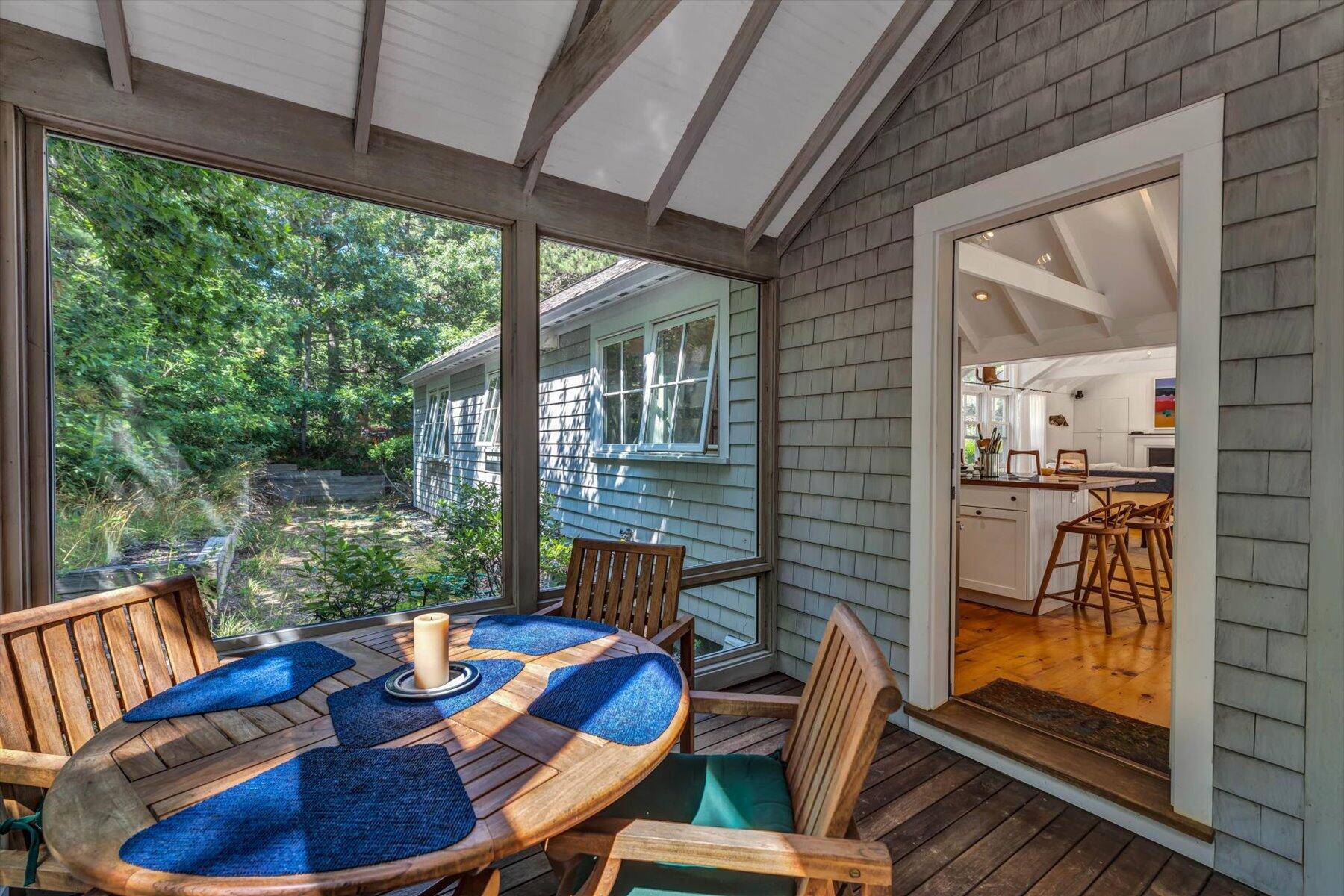 16 Tom's Hill Road Truro, MA 02666 - Photo 24 of 27 a view of a patio with a table chairs and a table