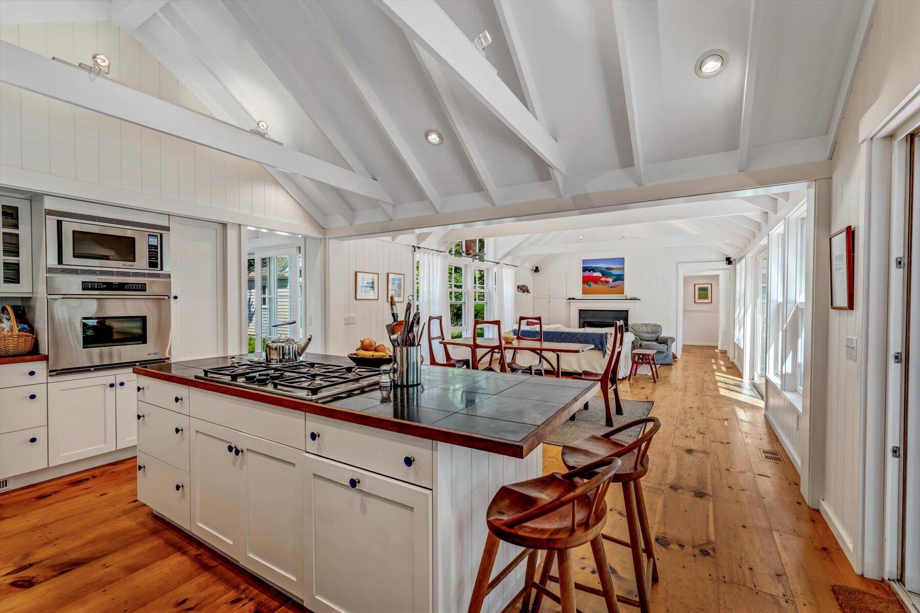 16 Tom's Hill Road Truro, MA 02666 - Photo 4 of 27 a kitchen with stainless steel appliances granite countertop a sink and cabinets