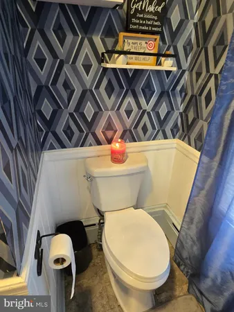 a bathroom with a toilet and a sink