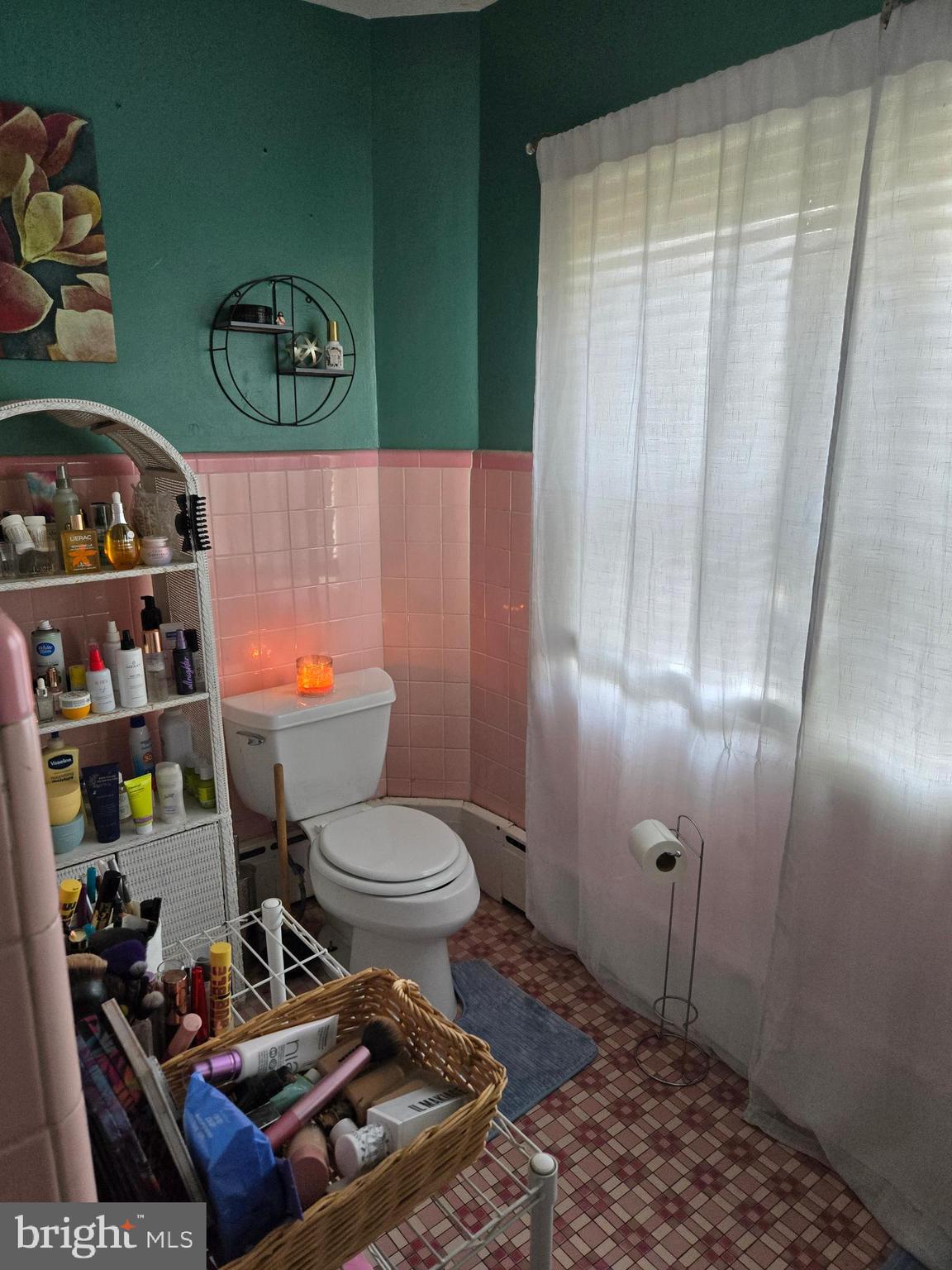 126 Maple Avenue Preston, MD 21655 - Photo 13 of 22 a bathroom with a toilet and a shower curtain