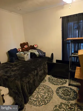 a bed room with a bed and a book shelf