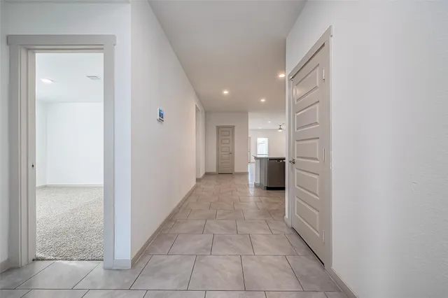a view of a hallway with a bedroom