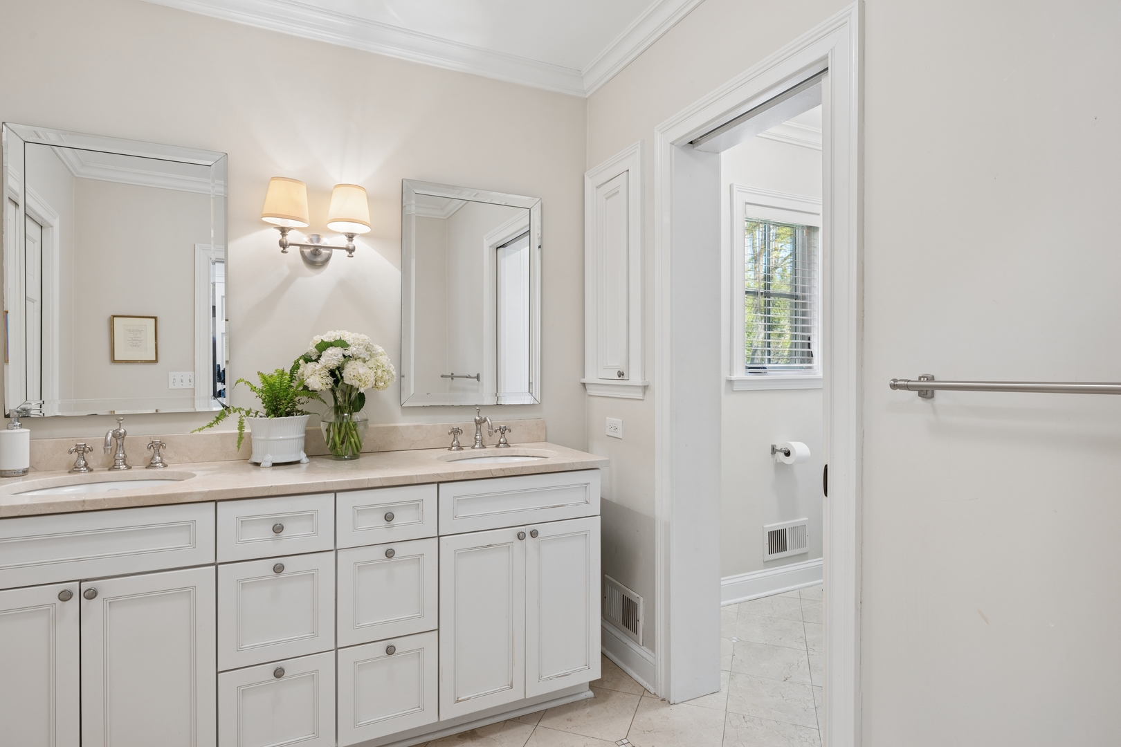936 Sunset Road Winnetka, IL 60093 - Photo 30 of 50 a bathroom with a double vanity sink and a mirror