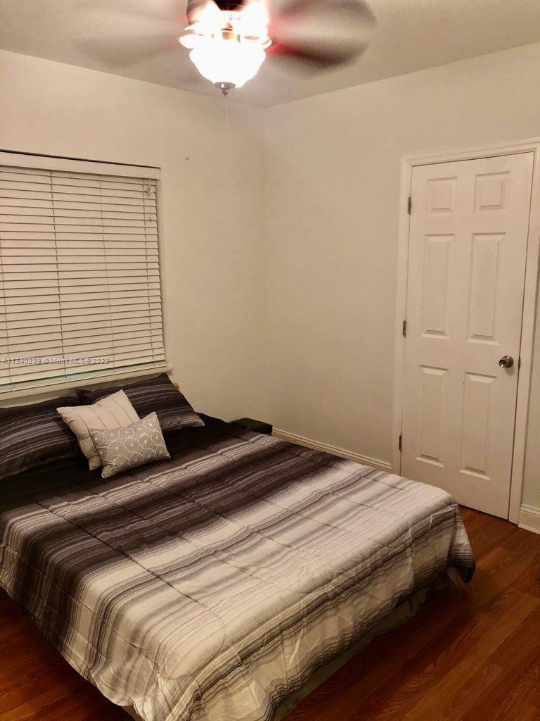 4220 Southwest 13th Street, Unit 4220 Miami, FL 33134 - Photo 13 of 14 a bedroom with a bed and a window