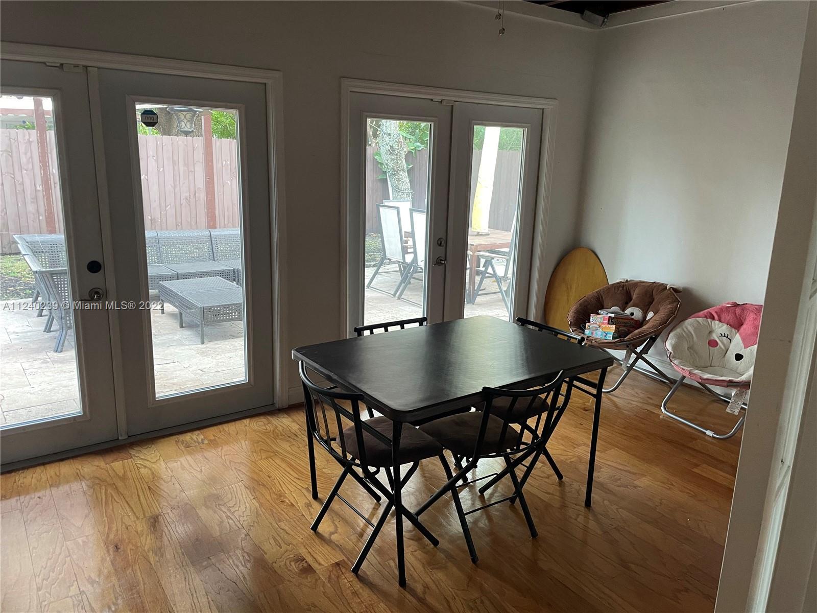 4220 Southwest 13th Street, Unit 4220 Miami, FL 33134 - Photo 2 of 14 a view of a dining room with furniture and window