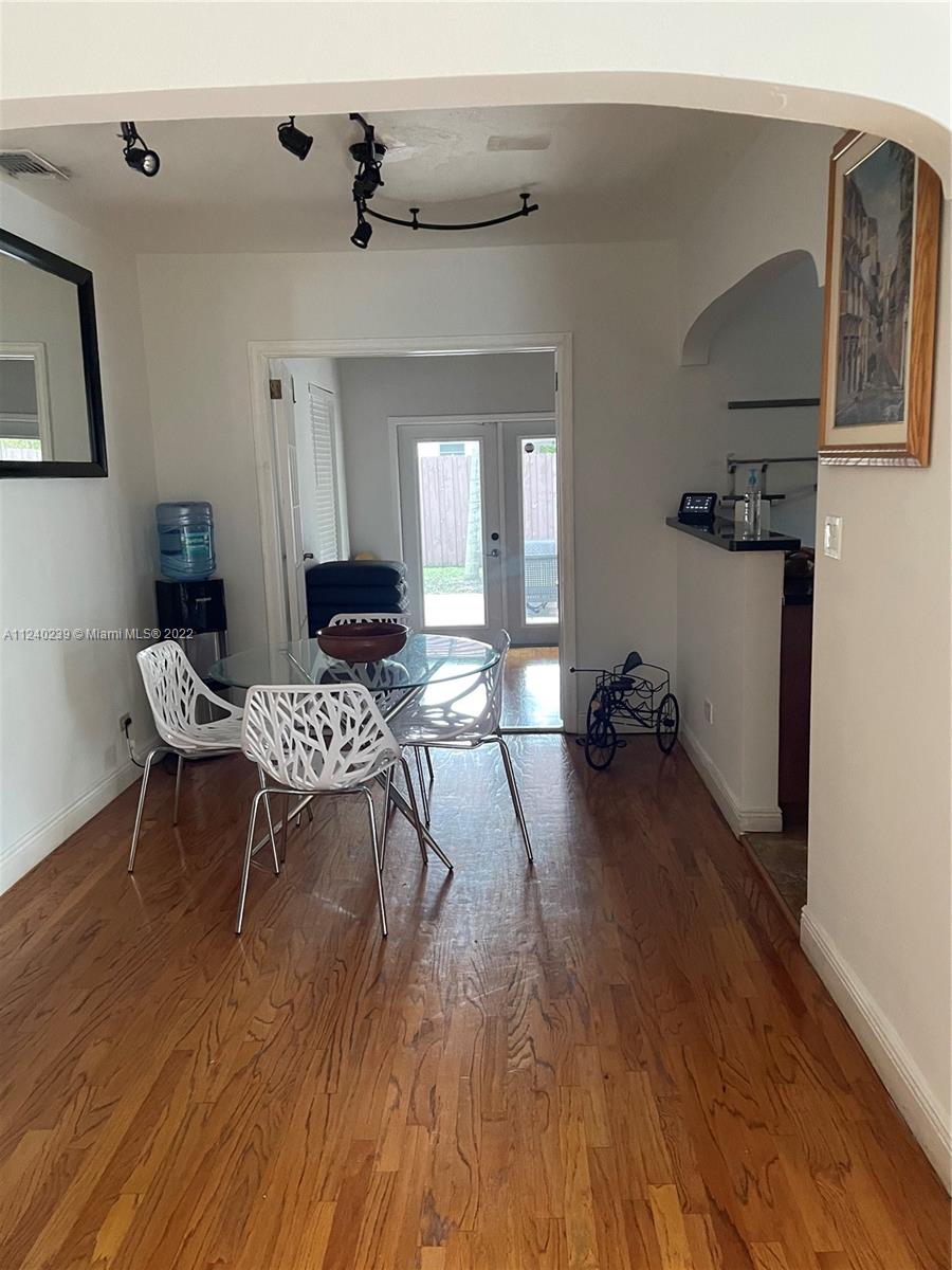 4220 Southwest 13th Street, Unit 4220 Miami, FL 33134 - Photo 4 of 14 a living room with furniture and a wooden floor