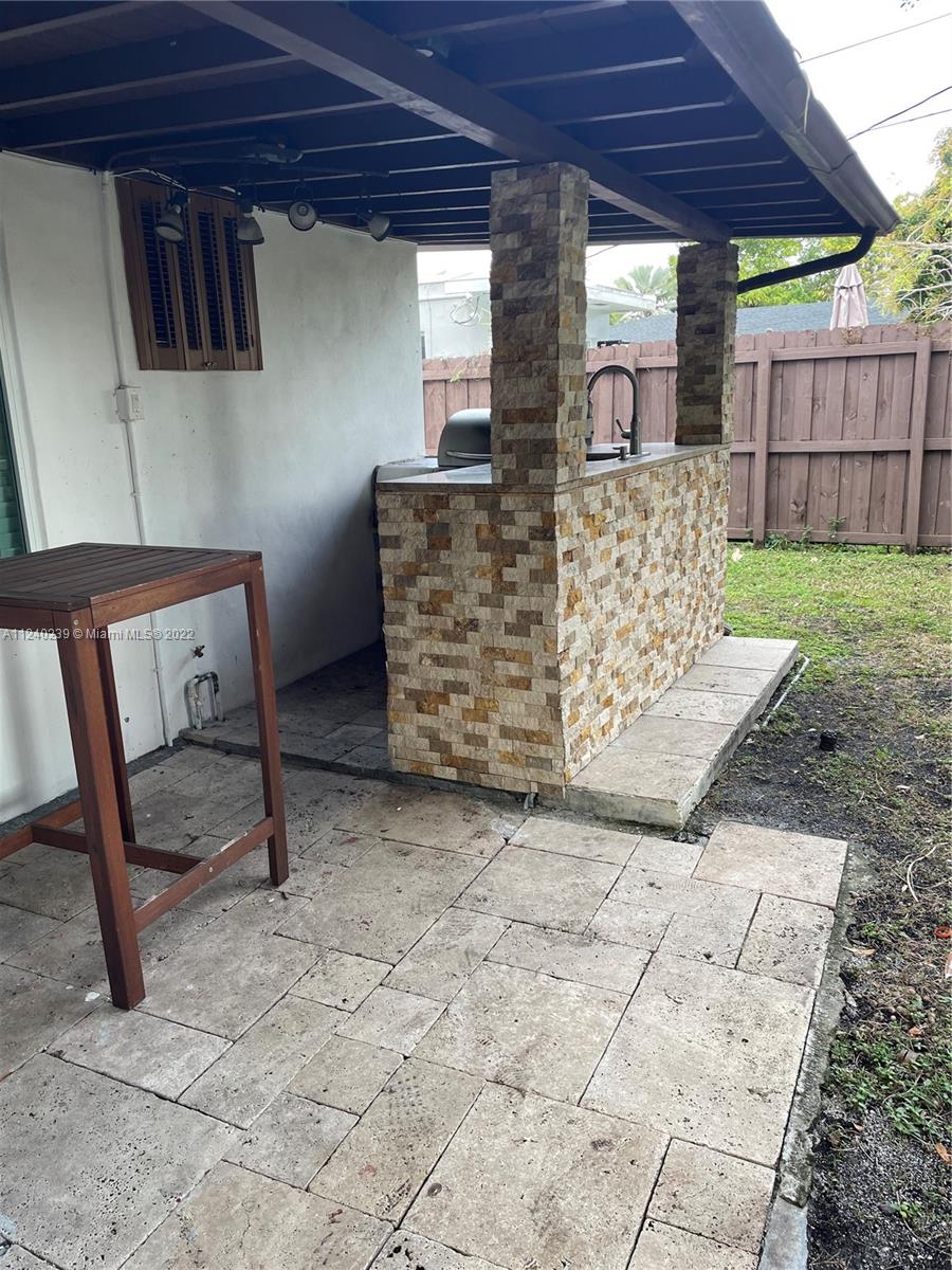 4220 Southwest 13th Street, Unit 4220 Miami, FL 33134 - Photo 9 of 14 a view of a backyard with wooden fence