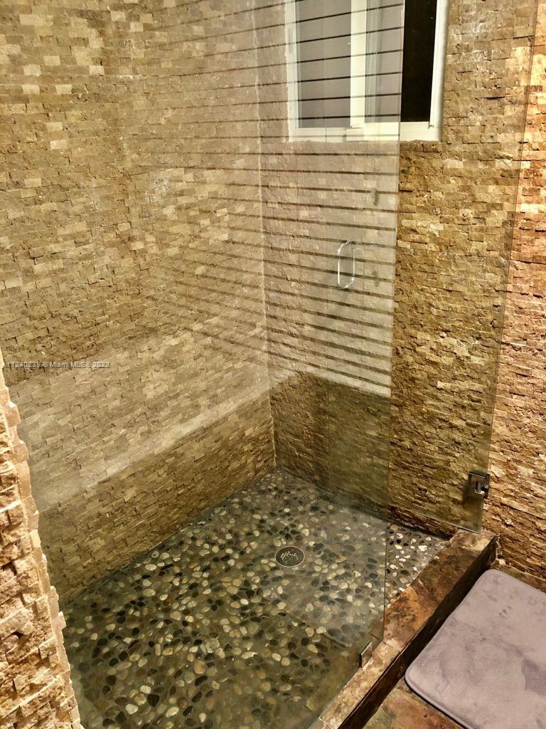 4220 Southwest 13th Street, Unit 4220 Miami, FL 33134 - Photo 10 of 14 a bathroom with a shower