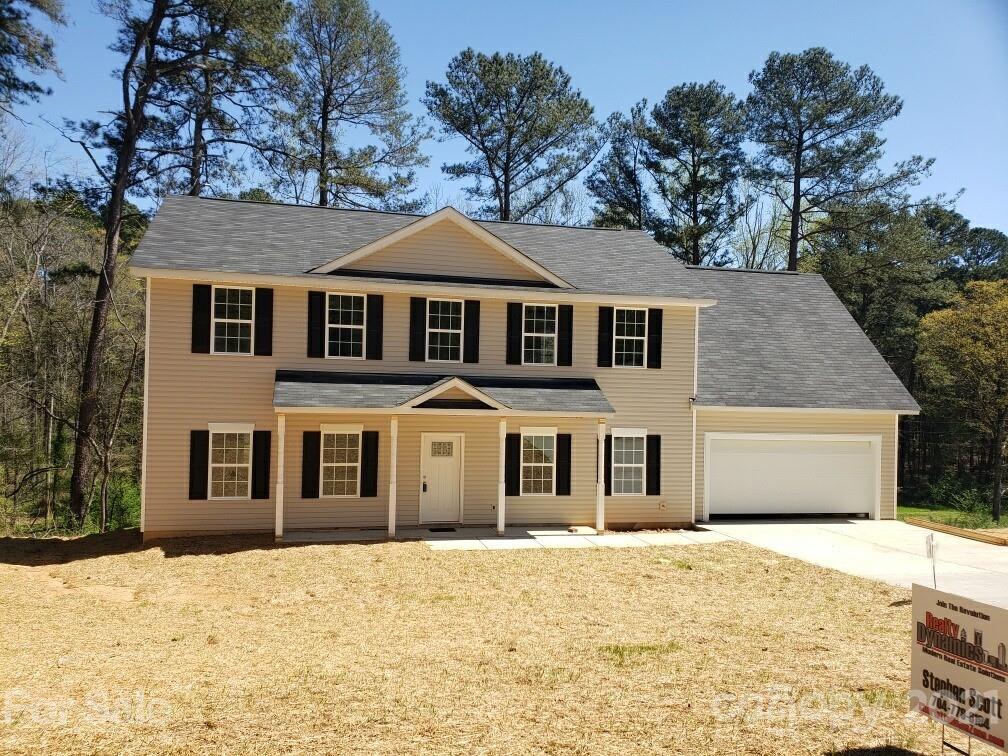 1810 Love Road Monroe, NC 28110 - Photo 1 of 13 a front view of a house with a yard