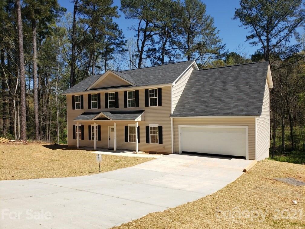 1810 Love Road Monroe, NC 28110 - Photo 2 of 13 a front view of a house with a yard