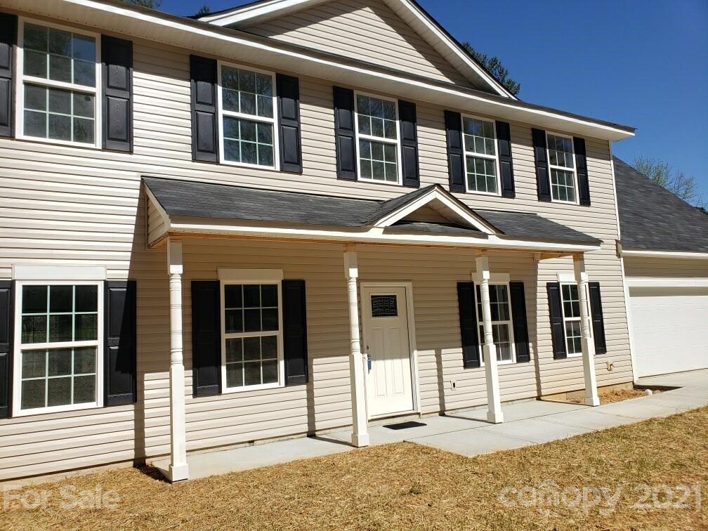 1810 Love Road Monroe, NC 28110 - Photo 3 of 13 a front view of a house with glass windows