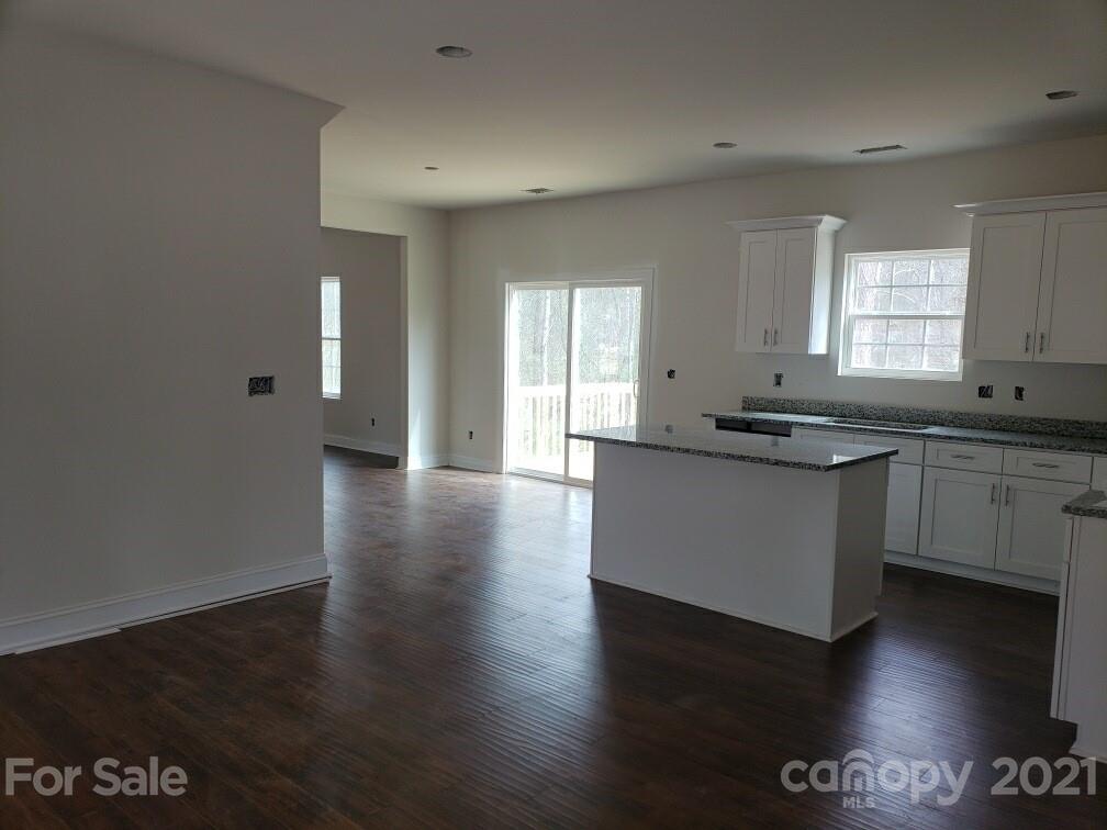 1810 Love Road Monroe, NC 28110 - Photo 5 of 13 a kitchen with granite countertop a sink and cabinets