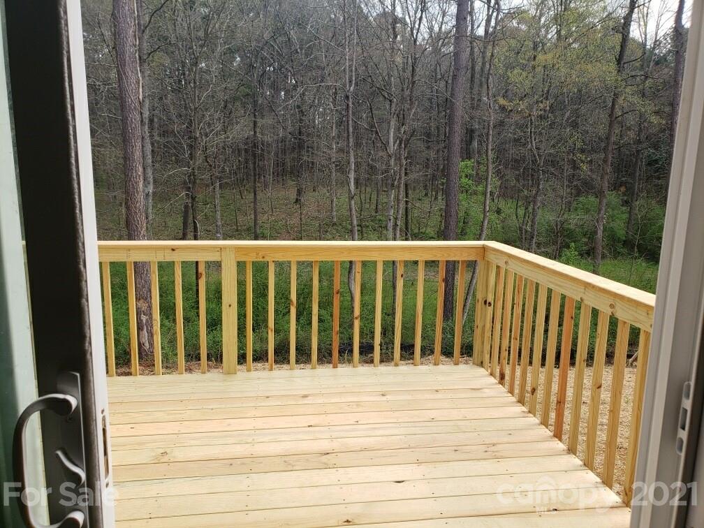 1810 Love Road Monroe, NC 28110 - Photo 10 of 13 a view of wooden balcony