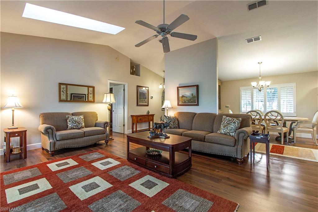 194 Albi Road, Unit 8 Naples, FL 34112 - Photo 3 of 12 a living room with furniture and wooden floor