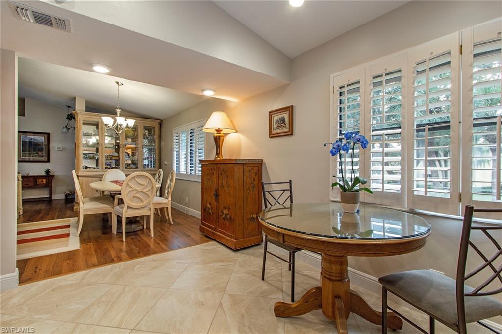 194 Albi Road, Unit 8 Naples, FL 34112 - Photo 6 of 12 a view of a dining room with furniture window and outside view