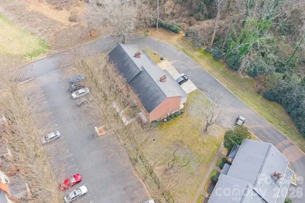 an aerial view of house with yard and swimming pool