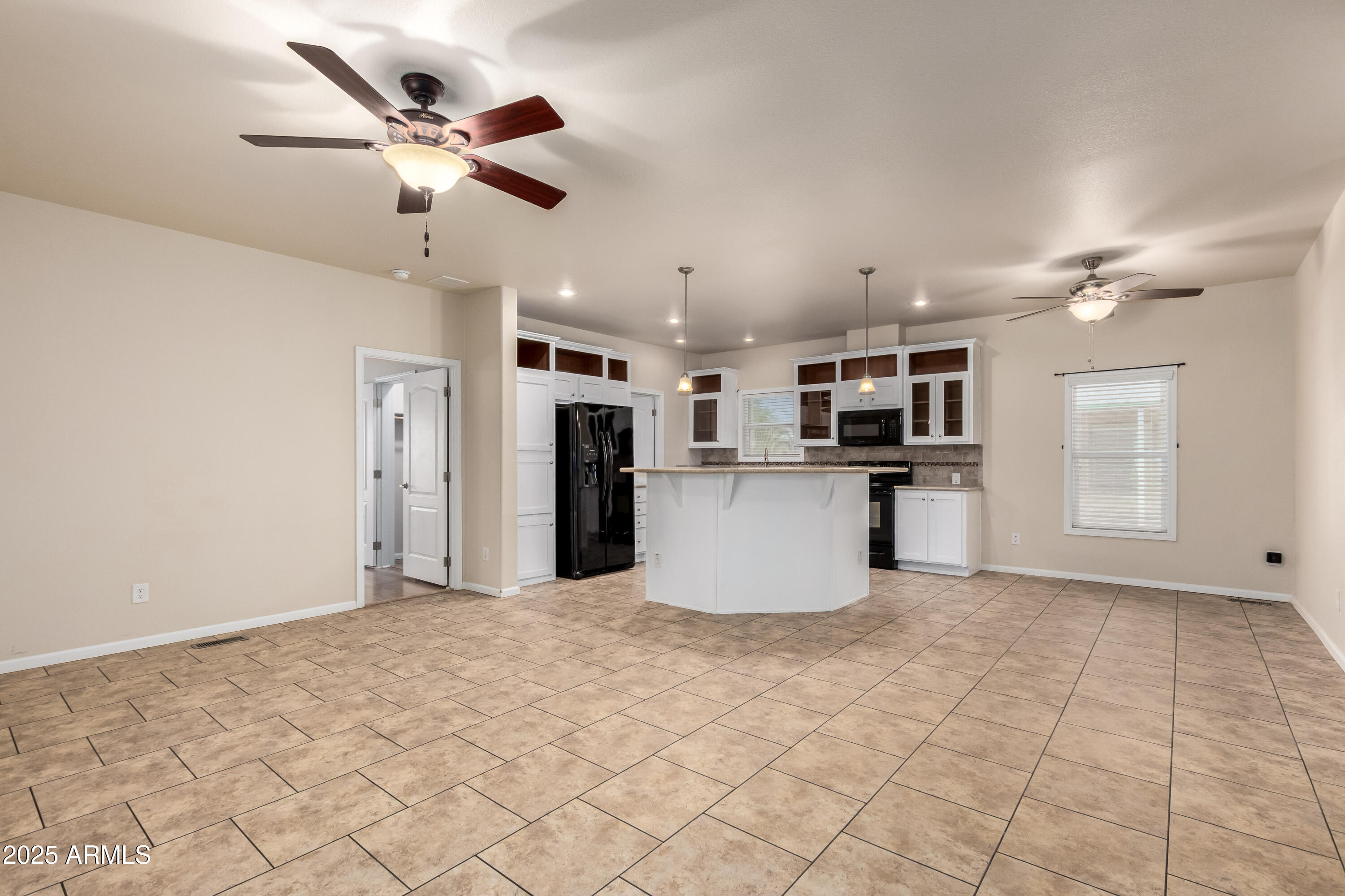 2000 South Apache Road, Unit 78 Buckeye, AZ 85326 - Photo 4 of 8 a view of kitchen with refrigerator and microwave
