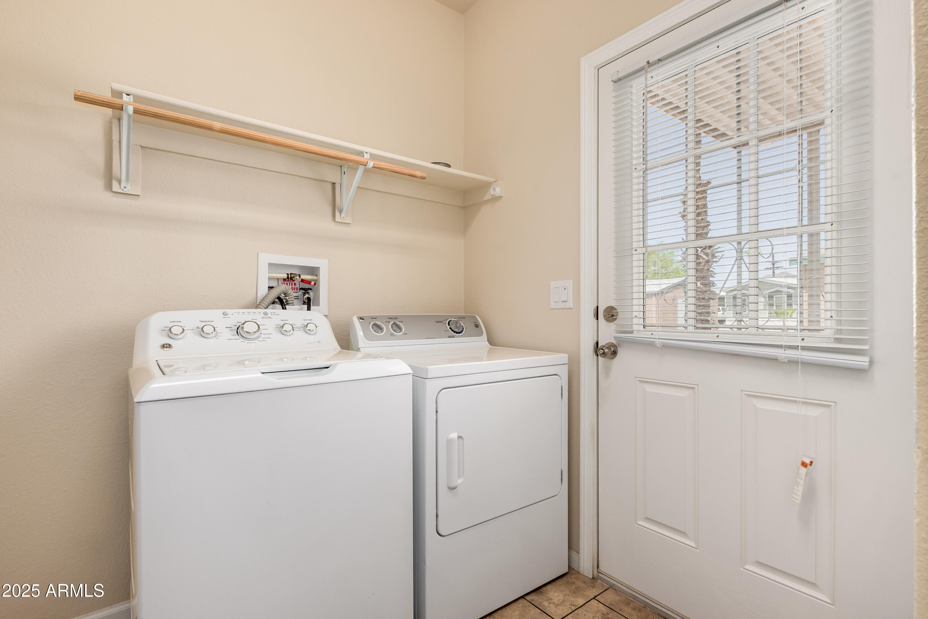 2000 South Apache Road, Unit 78 Buckeye, AZ 85326 - Photo 6 of 8 a utility room with dryer and washer