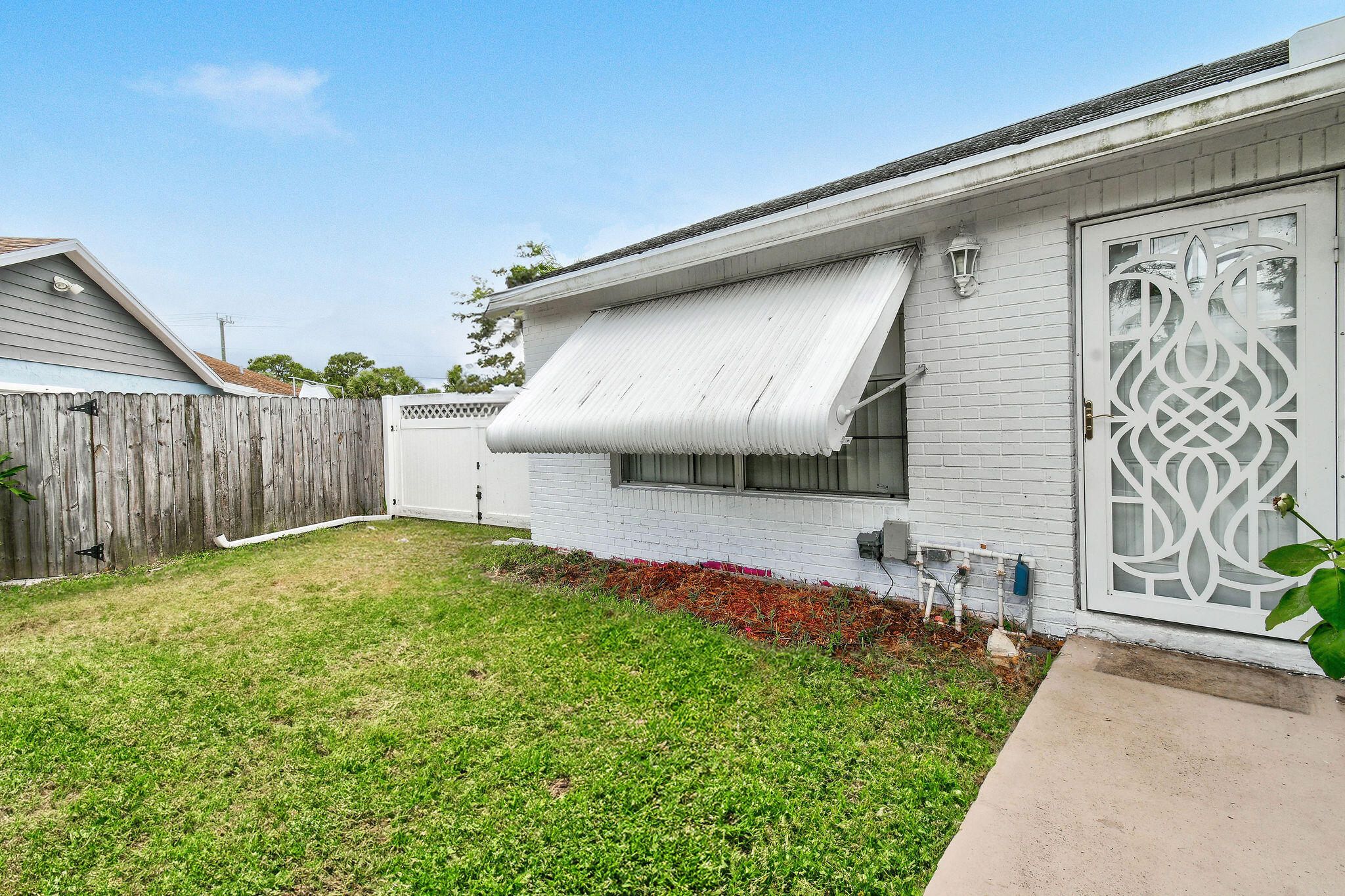 160 Banyan Circle Jupiter, FL 33458 - Photo 13 of 62 a front view of a house with garden