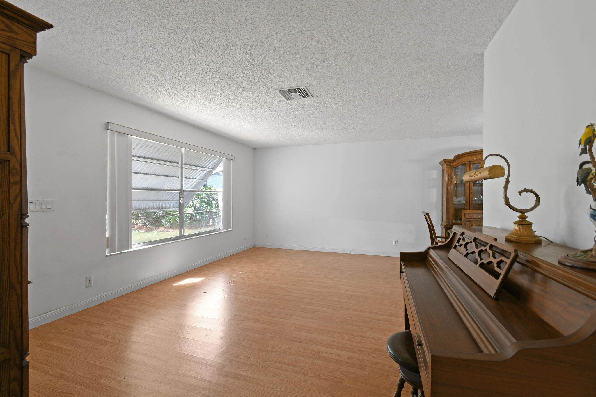 160 Banyan Circle Jupiter, FL 33458 - Photo 15 of 62 a view of a room with furniture and wooden floor