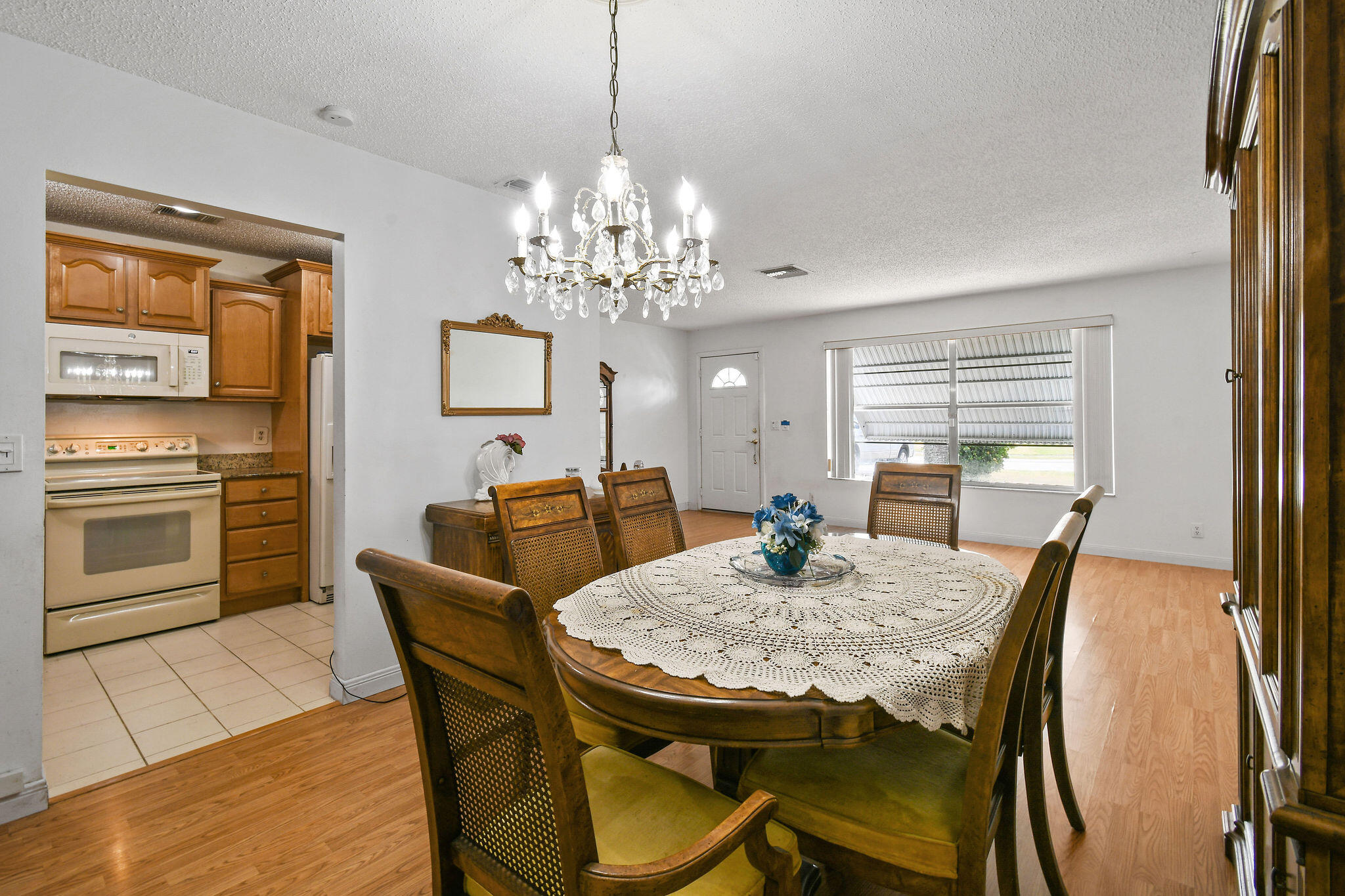 160 Banyan Circle Jupiter, FL 33458 - Photo 20 of 62 a view of a dining room with furniture window and wooden floor