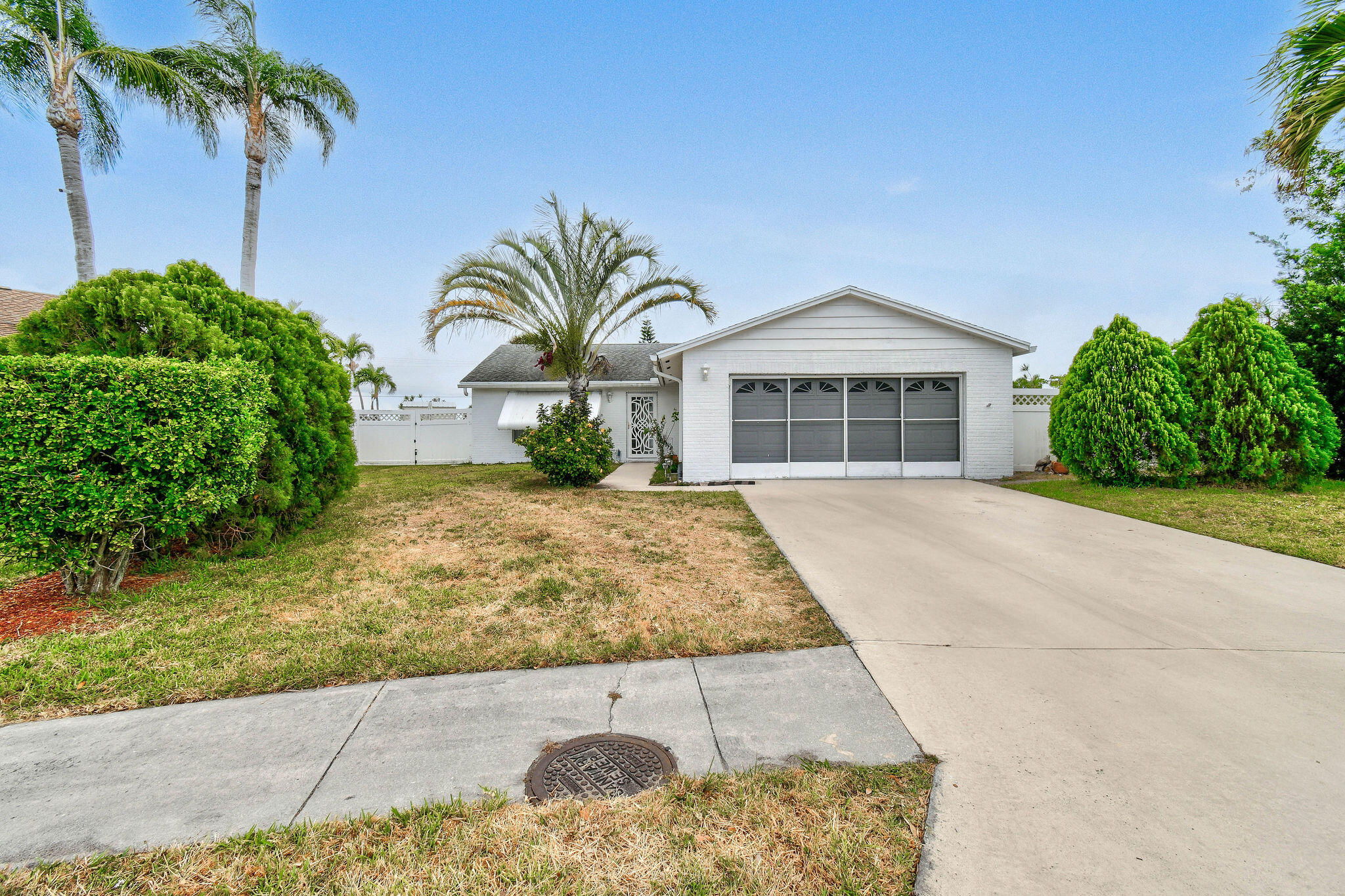 160 Banyan Circle Jupiter, FL 33458 - Photo 2 of 62 front view of a house with a yard