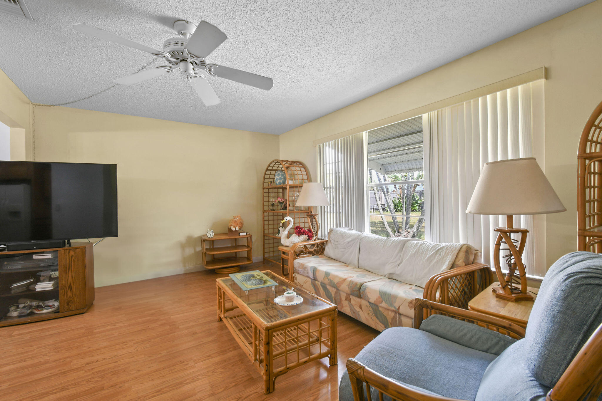 160 Banyan Circle Jupiter, FL 33458 - Photo 27 of 62 a living room with furniture a flat screen tv and a large window