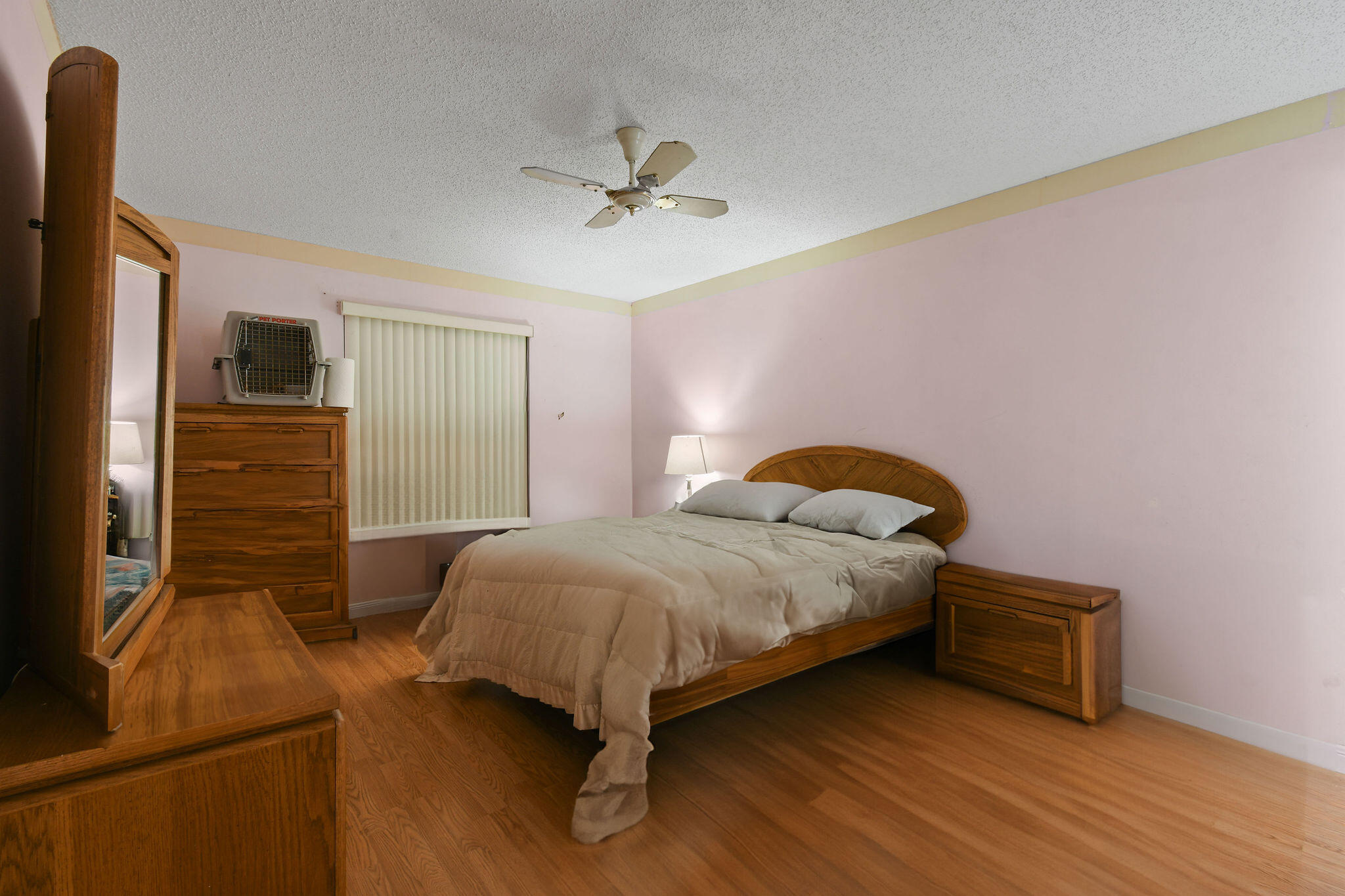 160 Banyan Circle Jupiter, FL 33458 - Photo 30 of 62 a bedroom with a bed and a ceiling fan