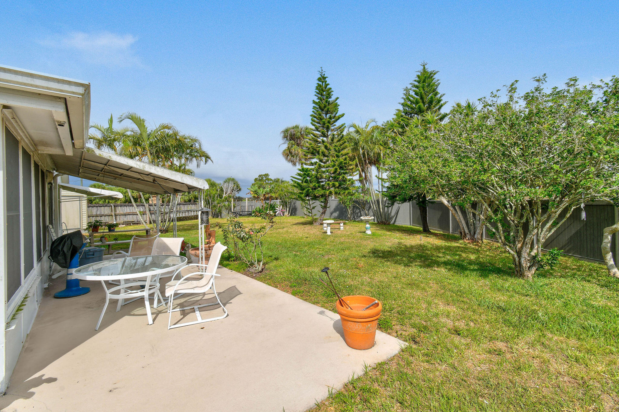 160 Banyan Circle Jupiter, FL 33458 - Photo 48 of 62 a view of a patio with a table and chairs