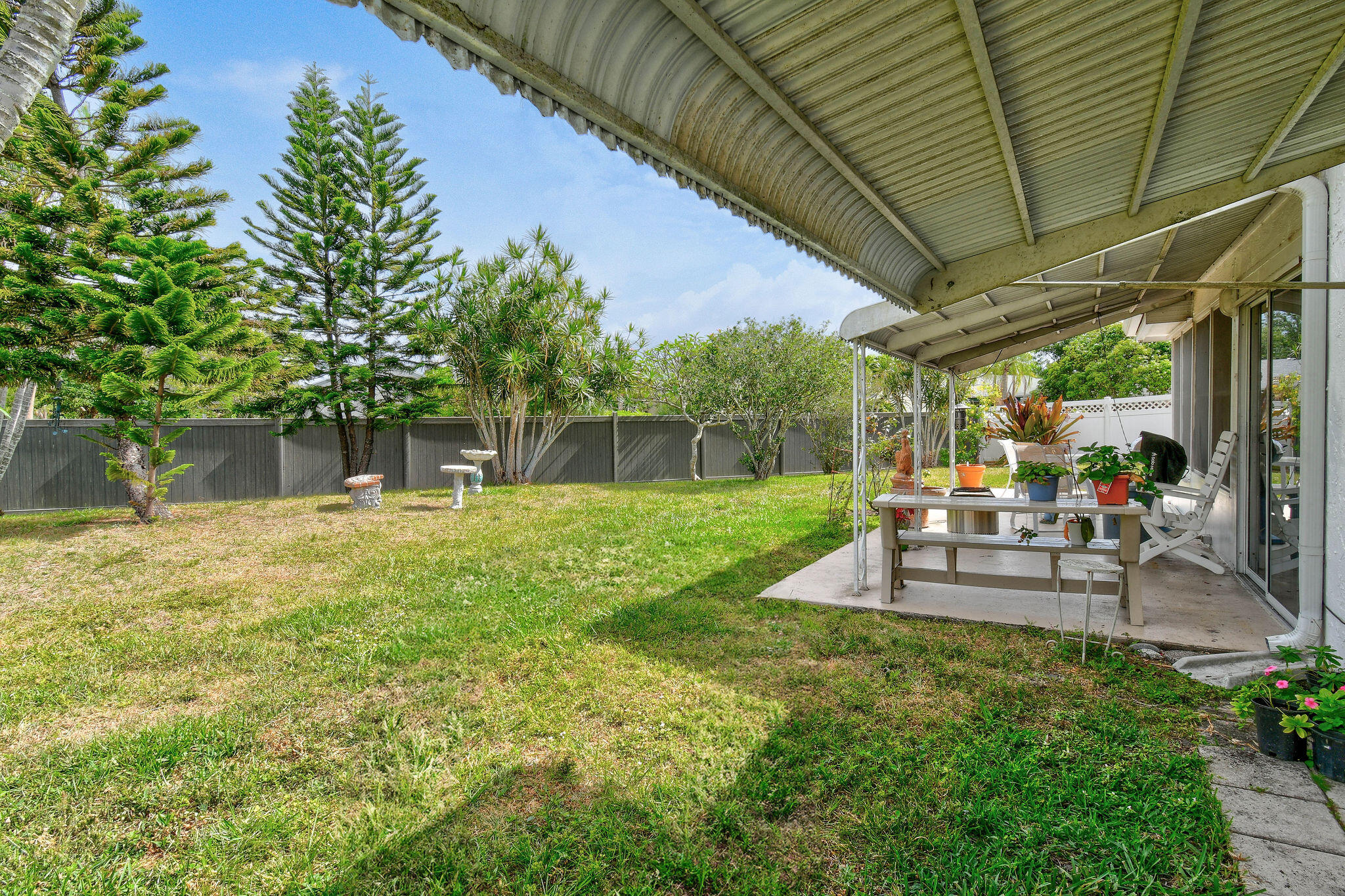 160 Banyan Circle Jupiter, FL 33458 - Photo 56 of 62 a view of a backyard with sitting area