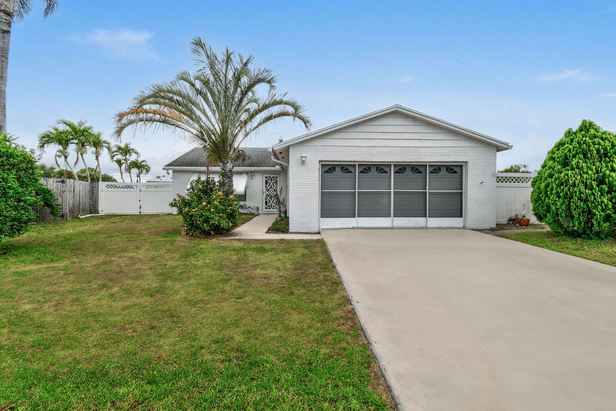 160 Banyan Circle Jupiter, FL 33458 - Photo 6 of 62 a front view of a house with garden