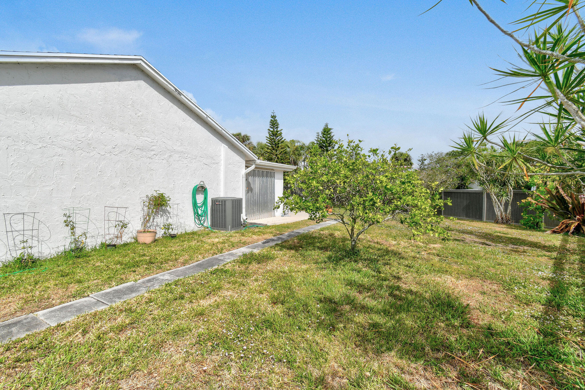160 Banyan Circle Jupiter, FL 33458 - Photo 61 of 62 a backyard of a house