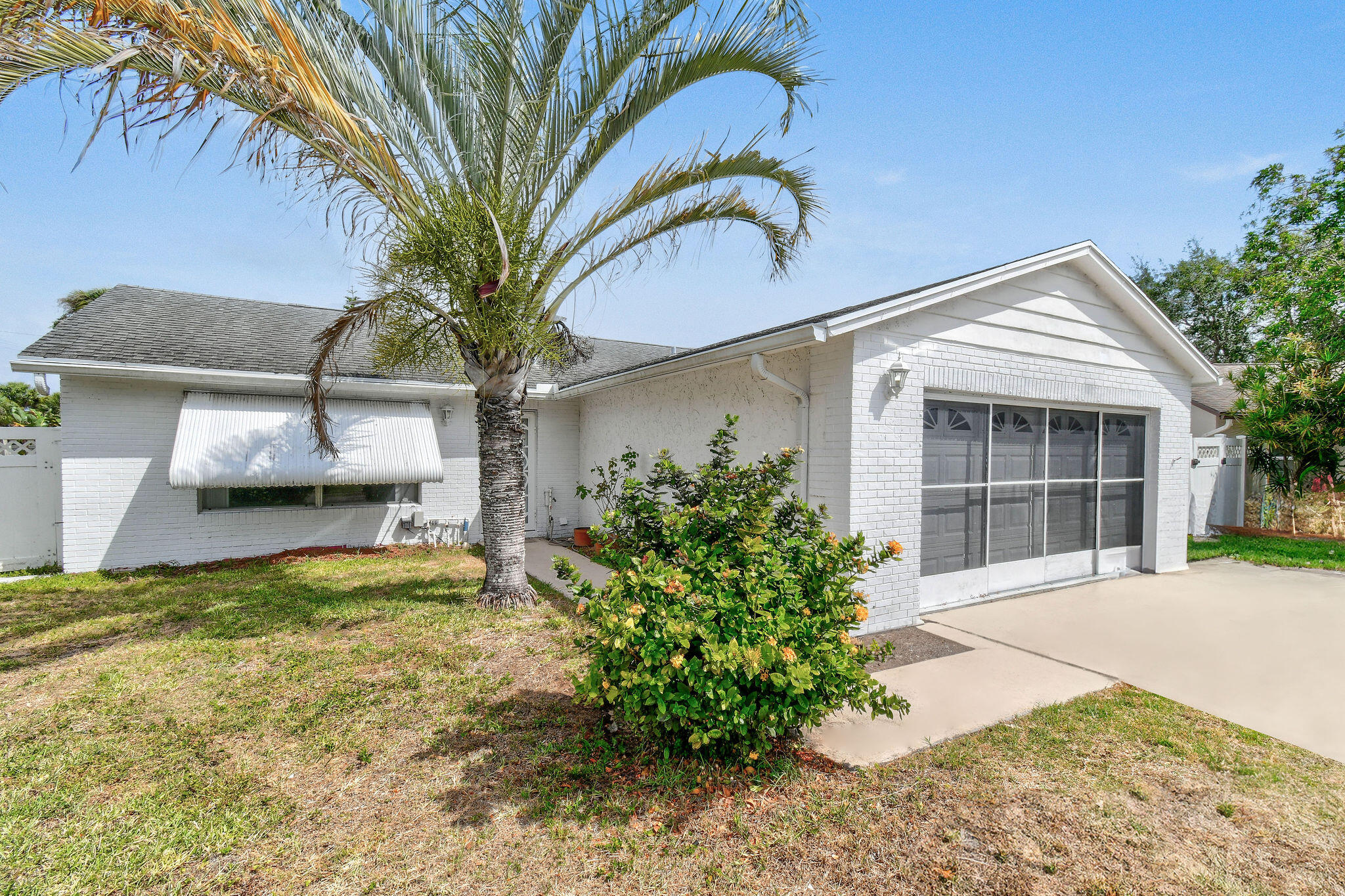 160 Banyan Circle Jupiter, FL 33458 - Photo 9 of 62 a front view of a house with garden