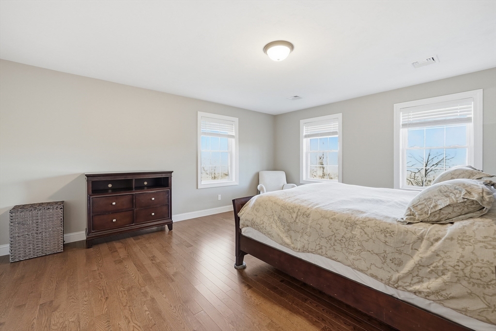 103 Rice Corner Road Brookfield, MA 01506 - Photo 22 of 39 a bedroom with a bed and a dresser