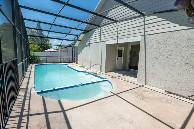 a view of a patio with a table and chairs