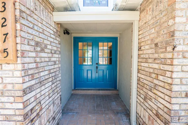a view of entryway with a brick wall