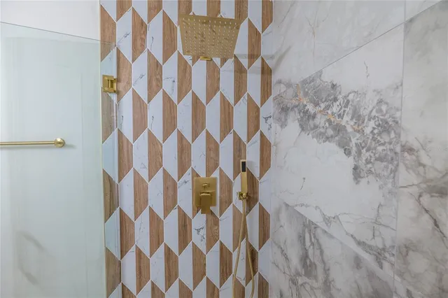 an aerial view of a house with a swimming pool and outdoor seating