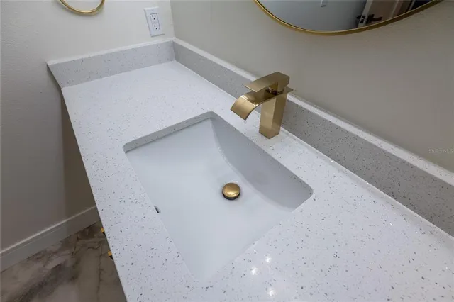 an aerial view of residential house with outdoor space and swimming pool