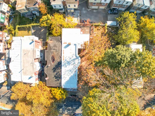 a aerial view of residential houses with outdoor space