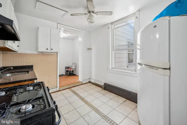 a view of a kitchen with electric appliances