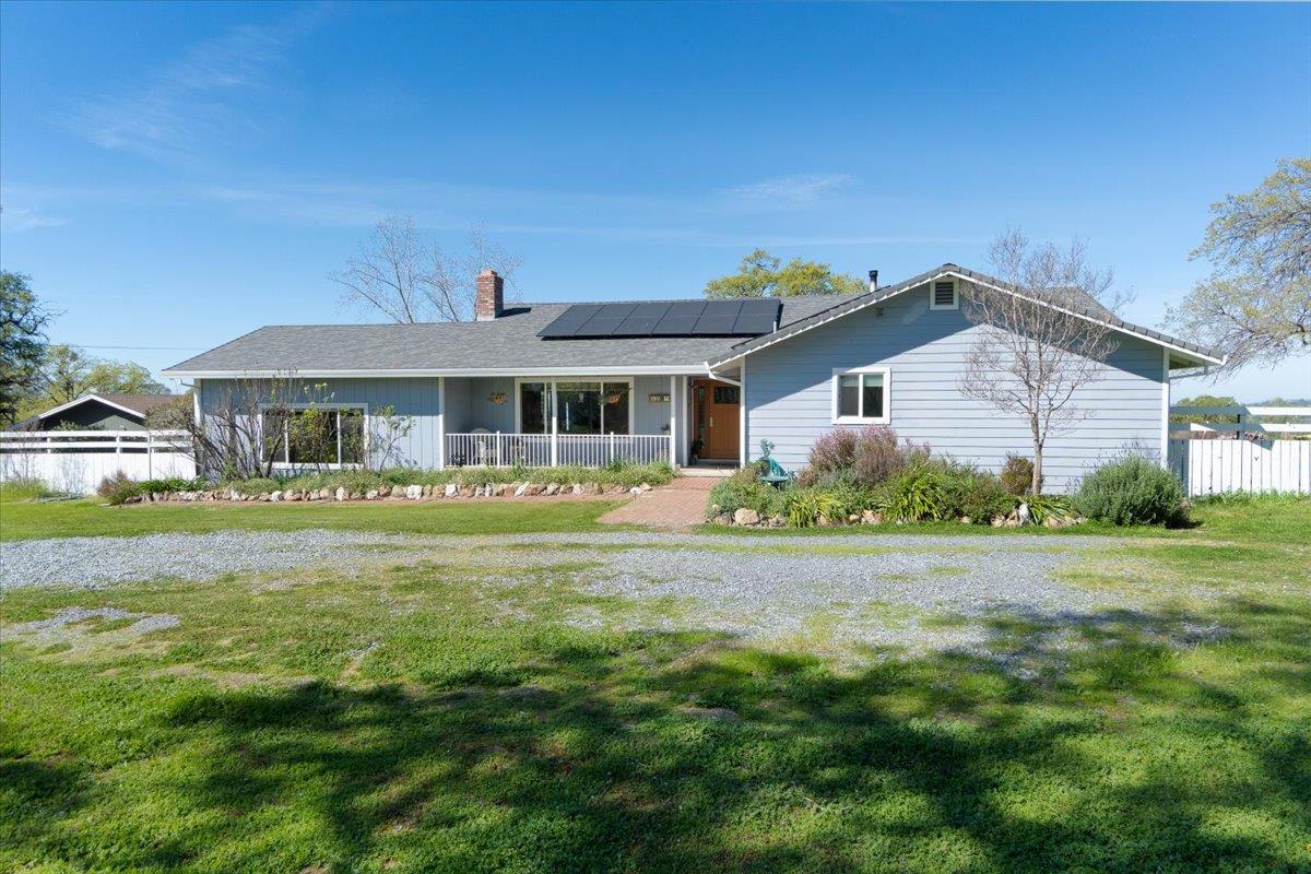6980 Crystal Boulevard El Dorado, CA 95623 - Photo 23 of 49 a front view of a house with a garden