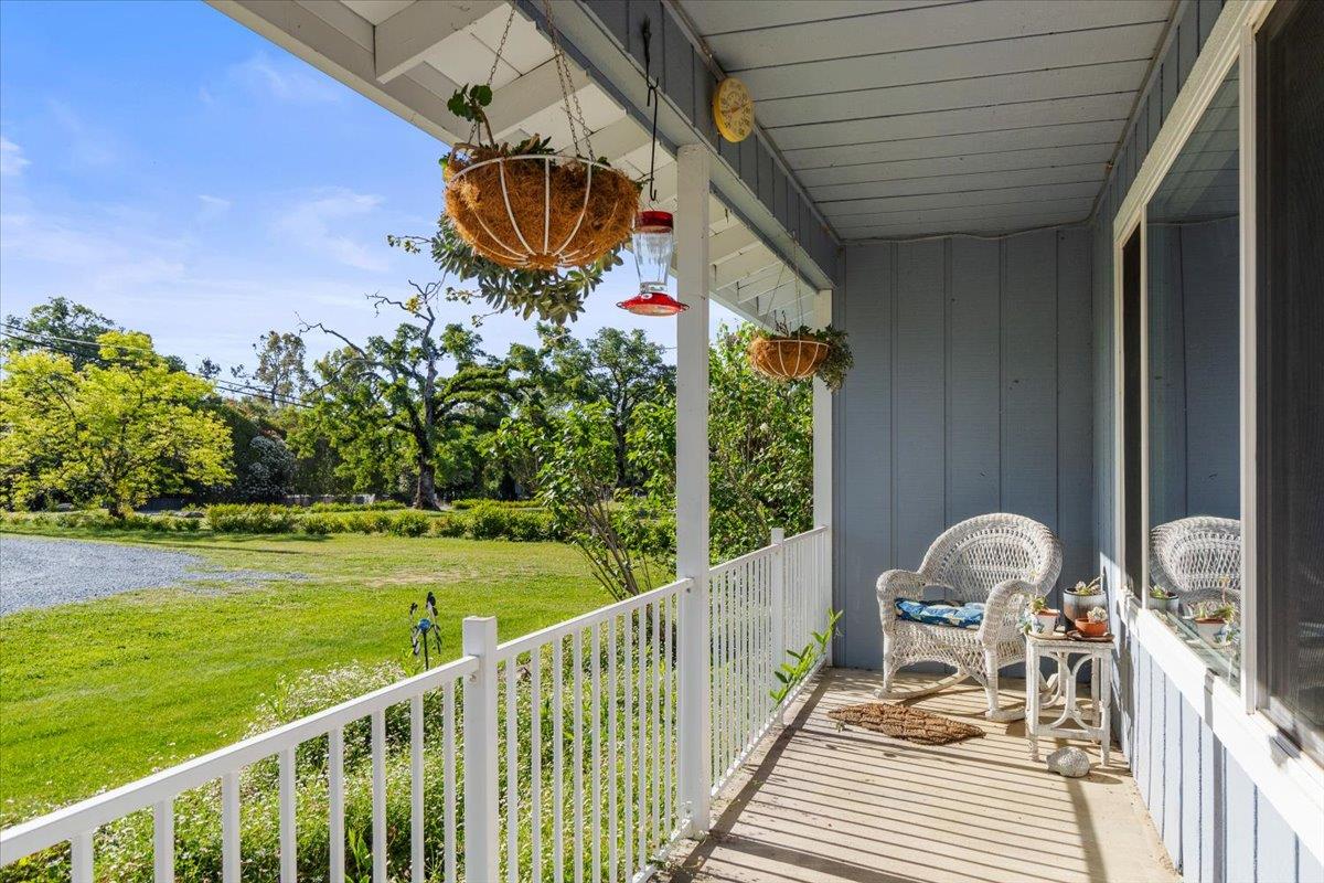6980 Crystal Boulevard El Dorado, CA 95623 - Photo 25 of 49 a view of a two chairs and table on the deck