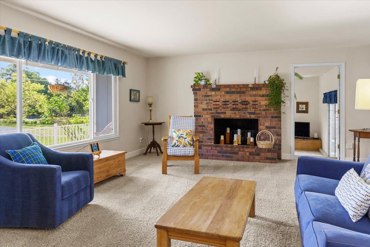 6980 Crystal Boulevard El Dorado, CA 95623 - Photo 28 of 49 a living room with furniture and a fireplace