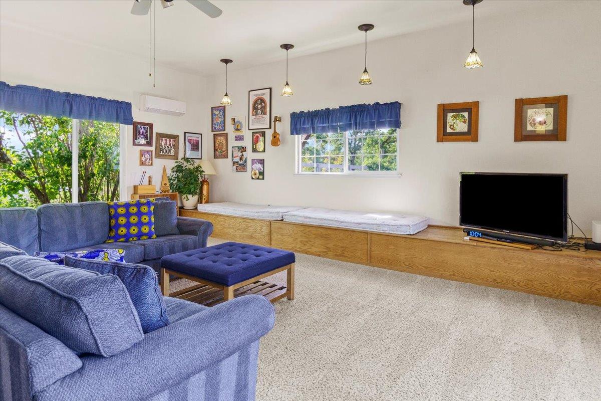 6980 Crystal Boulevard El Dorado, CA 95623 - Photo 33 of 49 a living room with furniture and a flat screen tv