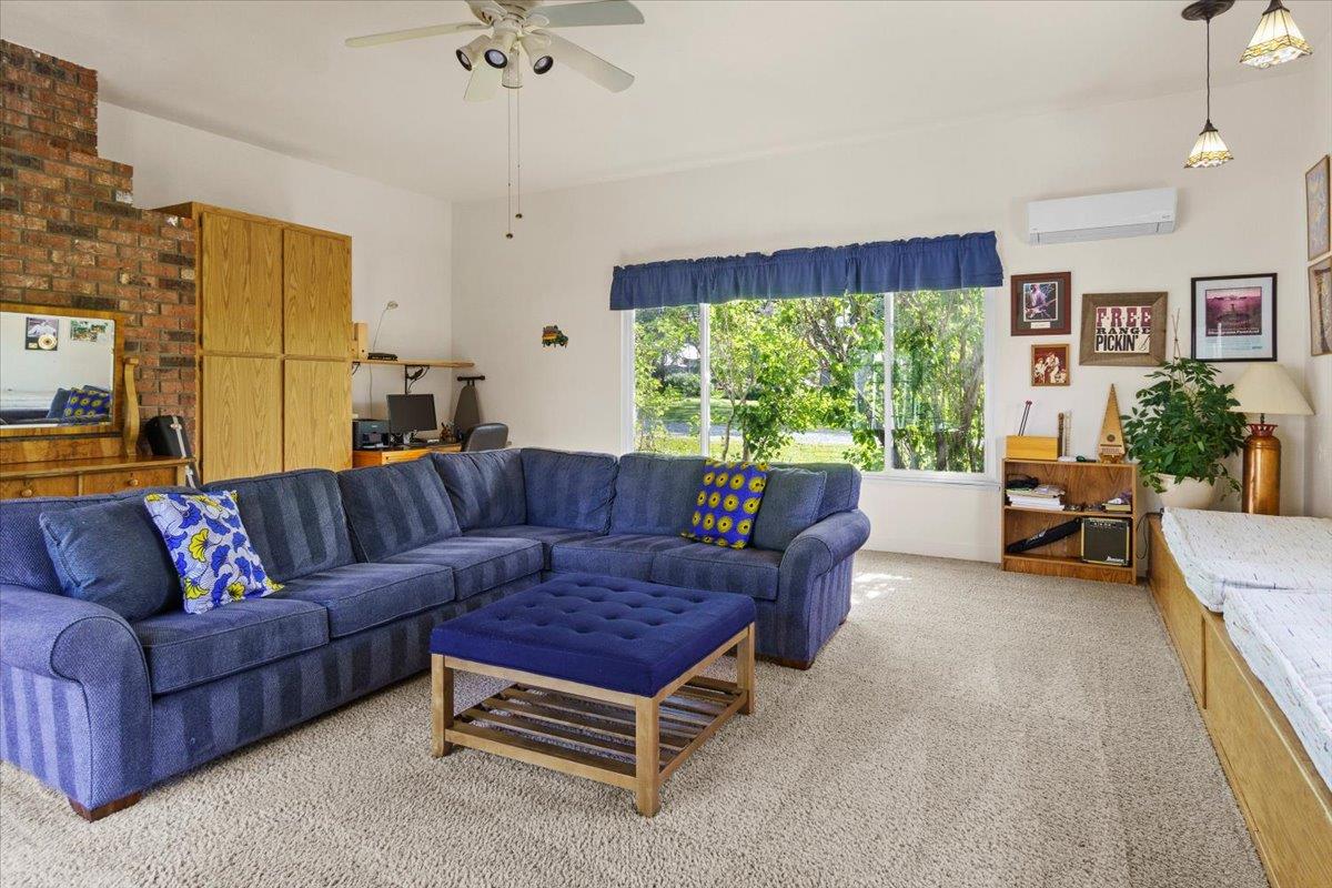 6980 Crystal Boulevard El Dorado, CA 95623 - Photo 35 of 49 a living room with furniture and a large window